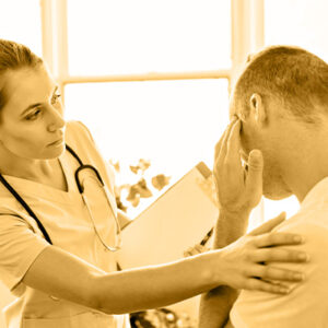 doctor examining patient with head injury