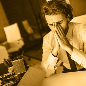 man at desk sad he has just been fired